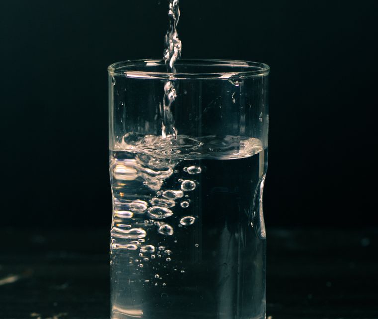 Clean, filtered drinking water poured into a glass